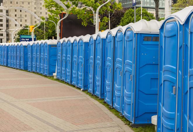 a line of portable restrooms at an outdoor wedding, catering to guests with style and comfort in Milpitas